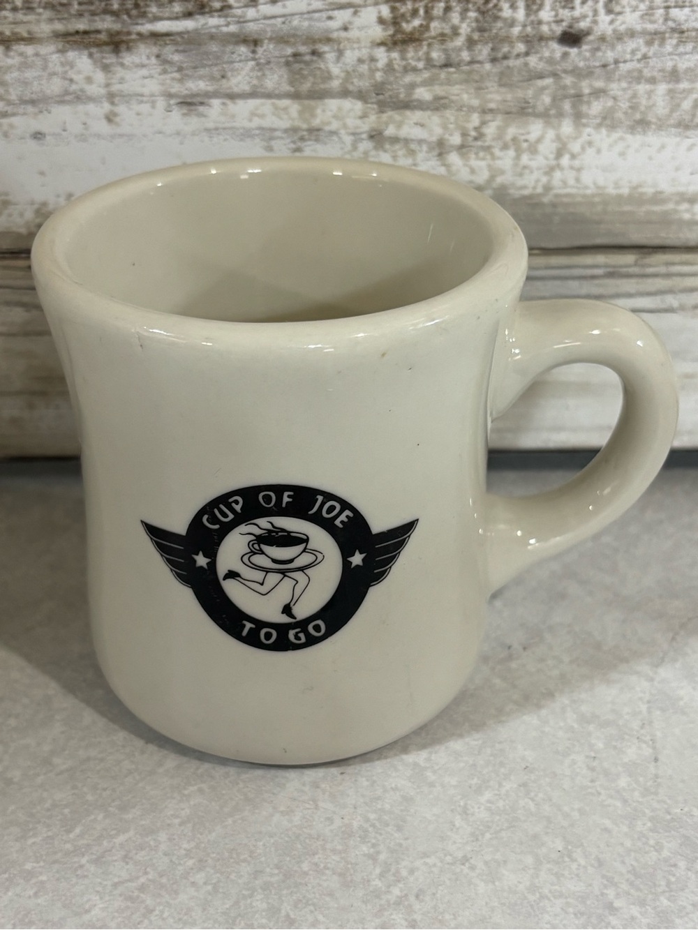 Heavy vintage coffee mug with advertising